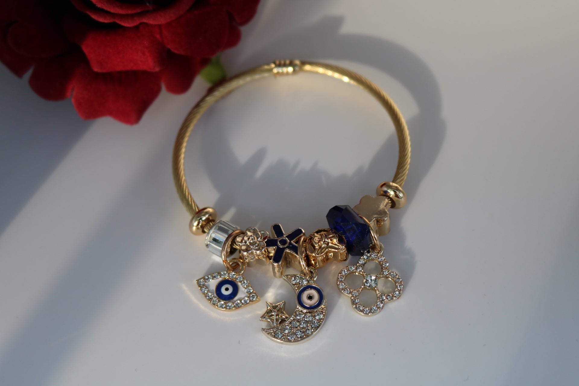 Blue eye charm bracelet on woman's wrist